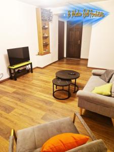 a living room with a couch and a table at Il Mulin Dell'Architetto in Fornaci di Barga