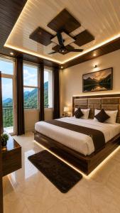 a bedroom with a large bed with a ceiling fan at Hotel Himalayan Heaven - A Most Luxury & Best Mountain View Hotel In Mussoorie By lilly in Mussoorie +22 photos