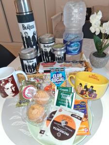 a table with a bunch of food on it at LENNON SUITE remis free Ezeiza in Ezeiza