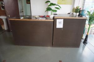 an office with a counter with plants on it at Hotel Raj Resort and Pool in Dogeta