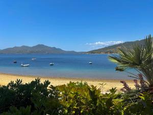 a view of a beach with boats in the water at Fuji Hotel in Edipsos