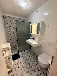 a bathroom with a toilet and a sink at Villa Gromaca in Omišalj +41 photos
