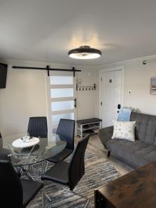 a living room with a couch and a table at Salty & Sweet 303 in Old Orchard Beach