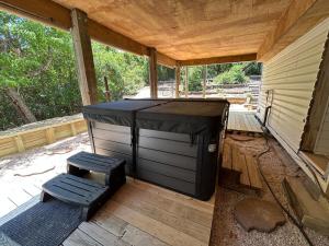 a screened in porch with a jacuzzi at 3BR 3BA Beach House in Kitty Hawk Beach