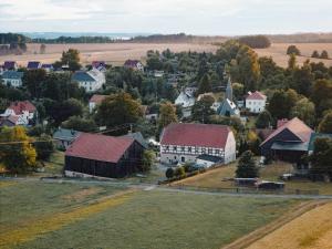 an aerial view of a small town with a barn at Ferienwohnung Schwerg in Hohnstein