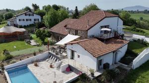 an aerial view of a house with a swimming pool at Bed & Breakfast Perbos 1556 in Labastide-Clairence
