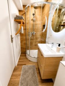 a bathroom with a sink and a shower at Cocon avec terrasse proche plages et centre in Dives-sur-Mer +7 photos