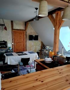 a living room with a bed and a table at Krusenhofilona in Krusendorf