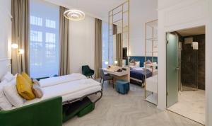 a hotel room with two beds and a mirror at SOPHIA PALACE Hotel Budapest in Budapest