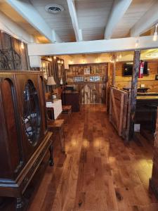 a large room with wooden floors and wooden walls at The Stable at Windmill Ridge Farm in Fredonia +26 photos