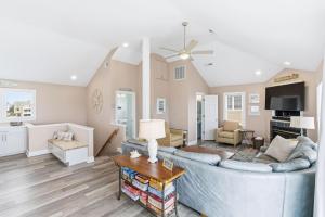 a living room with a couch and a table at Beach Nutz in Nags Head