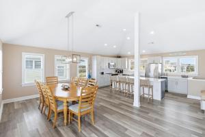 a kitchen and dining room with a table and chairs at Beach Nutz in Nags Head