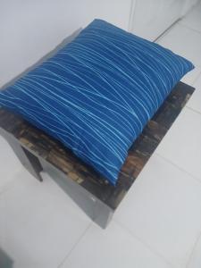 a blue pillow sitting on top of a table at Blue Song Villa in Braco
