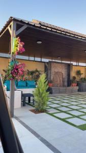 a patio with a table and chairs and flowers at WesamFarm in Amman +15 photos
