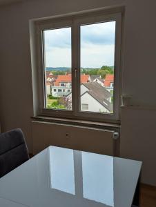 a room with a table and a large window at Ferienwohnung Altstadt Lemgo in Lemgo
