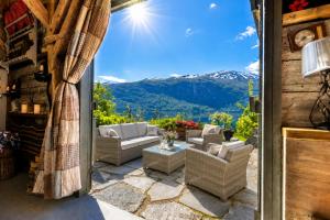 a patio with furniture and a view of mountains at Villa Lilleheim in Breim