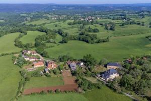 an aerial view of a house in a green field at Chalet 3 in Gelle