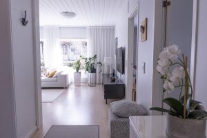 a living room with a couch and a table at Villa White Star in Rovaniemi
