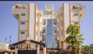 a large white building with a kedia sign on it at Dobajo Homes2 in Kisumu