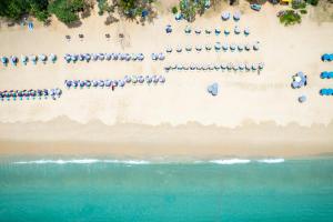 an overhead view of a beach with chairs and umbrellas at Anthiya Seaview Villa Hotel Phuket in Kata Beach