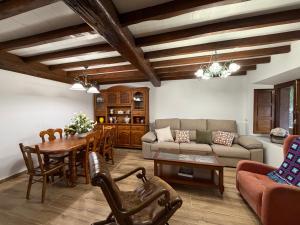 a living room with a couch and a table at Casa Mayucu in Celis