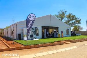 a white tent with a banner in front of it at Hillview inn hotel in Serowe