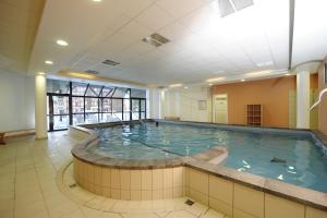 a large indoor swimming pool in a building at Castor & Pollux in Risoul