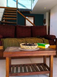 a coffee table with a basket on top of it at Camiare Aparts in Villa General Belgrano