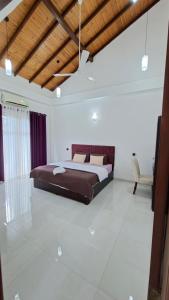 a bedroom with a large bed in a room at Haven Stay in Sri Jayewardenepura Kotte