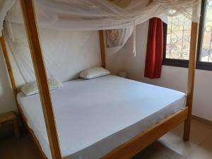 a bedroom with a bunk bed with a white mattress at Villa Na aldiana in Sali Nianiaral +68 photos