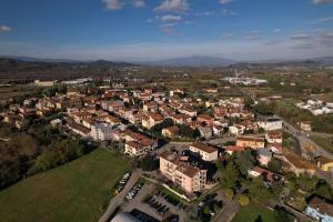 an aerial view of a small town with buildings at Albergo La Posta Arezzo in Badia Al Pino