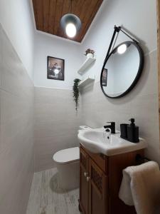 a bathroom with a sink and a mirror at Casa Mayucu in Celis +37 photos