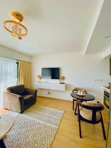 a living room with a couch and a table at Nairobi Comfort Suites in Nairobi