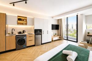 a large apartment with a kitchen and a living room at On Park Luxury One Bed & Bath- in Cape Town