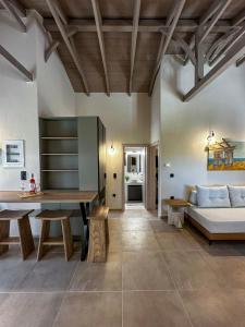 a living room with a couch and a table at THAλEIA Holiday Home in Nea Kallikrateia