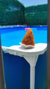 a piece of cake sitting on a plate on a table at Sicilia Bedda C&G in Acireale