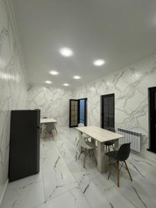 a room with tables and chairs and a wall with marble at Bank Hotel in Yeghegnadzor +82 photos