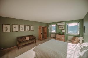 Postel nebo postele na pokoji v ubytování Villa Angelo + 29 fotografií