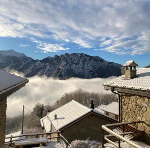 a view from the roof of a house in the snow at Baita LoKa-Baita panoramica tra Lago di Como e Grigna in Bellano