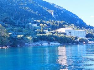 a view of a river with a mountain in the background at La casa di Aurora - Room A - Boutique Hotel in Agios Ioannis Peristerion