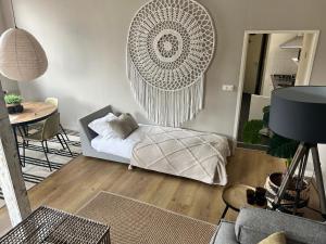 a living room with a bed and a table at Kalckmate in Goes