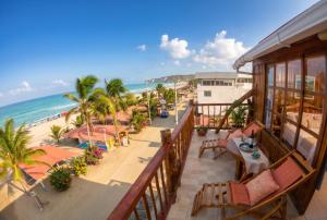 an aerial view of the beach from the balcony of a resort at Cocoa Beachfront Inn in Canoa