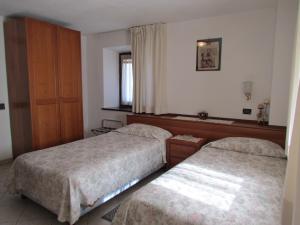 Postel nebo postele na pokoji v ubytování Residence Du Chateau