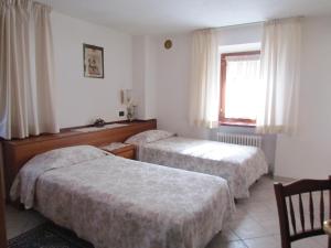 Postel nebo postele na pokoji v ubytování Residence Du Chateau