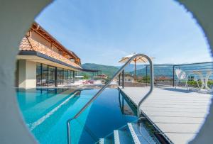 a view of a swimming pool with a resort at Seaberhof Kaltern in Caldaro