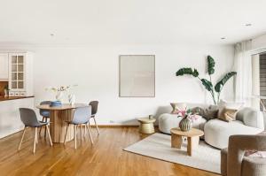 a living room with a couch and a table at The Nordic Escape - Oceanview - Hetlevik in Askøy