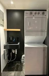 a kitchen with a sink and a white refrigerator at Saray-ı Hümayun in Santa Rosita
