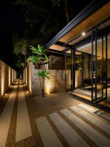 an external view of a building at night at Makham Villa River Kwai in Kanchanaburi City