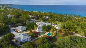 an aerial view of a house and the ocean at Stella Maris Resort Club in Stella Maris