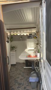 a kitchen with a sink and a counter in a trailer at Cottage in Ciudad Quesada in Ciudad Quesada +24 photos
